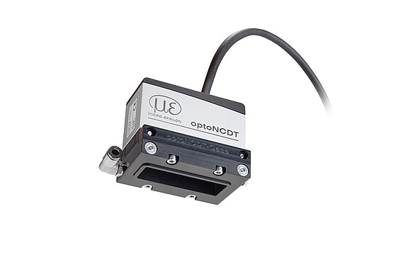 Sensor láser con carcasa de protección